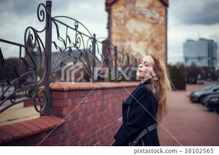 oman with long blond hair on wind oman with long blond hair on wind 38102565