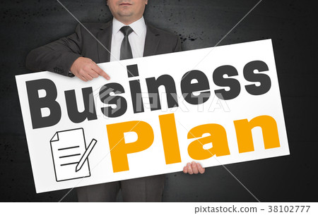 Business plan poster is held by businessman 38102777