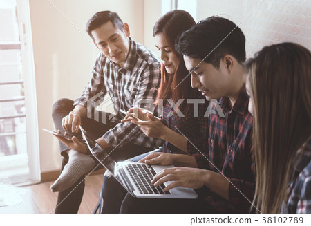Casual worker sitting in a row in team meeting Casual worker sitting in a row in team meeting 38102789