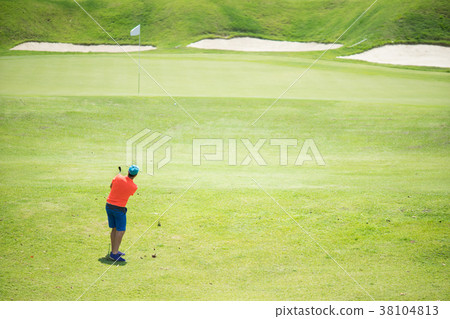 Golfer hitting golf shot with club Golfer hitting golf shot with club 38104813