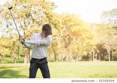 Asian man golf player swinging driver golf club  38109304