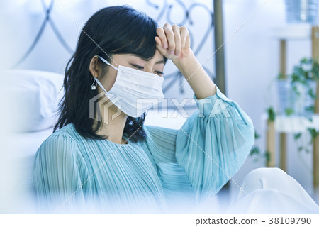 Woman wearing a mask and having a hard time 38109790