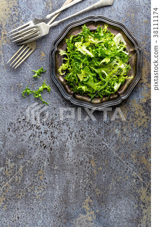 Frize lettuce salad, fresh frisee Frize lettuce salad, fresh frisee 38111174