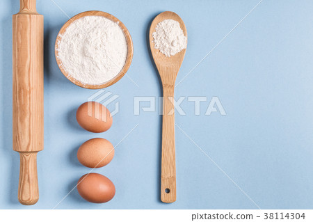 Ingredients for baking  on a blue background. 38114304