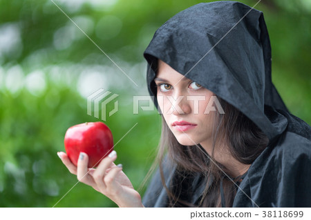 Young beautiful woman with red apple. 38118699