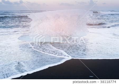 Breaking Ice on black sand beach, Iceland 38118774