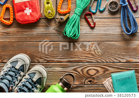 Travel items for hiking over wooden background 38120573