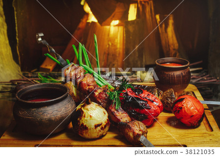 grilled meat and vegetables onion tomatoes grilled meat and vegetables onion tomatoes 38121035