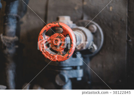 vintage red valve handle closeup - old technology vintage red valve handle closeup - old technology 38122845