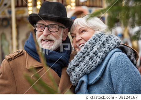 Carefree mature loving couple laughing outdoor 38124167