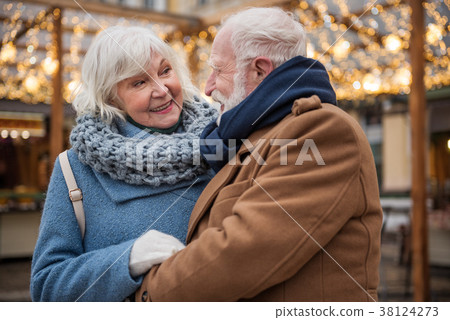 Cheerful mature loving couple relaxing outdoor Cheerful mature loving couple relaxing outdoor 38124273