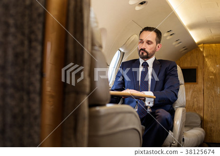 Serene gentleman using private jet Serene gentleman using private jet 38125674