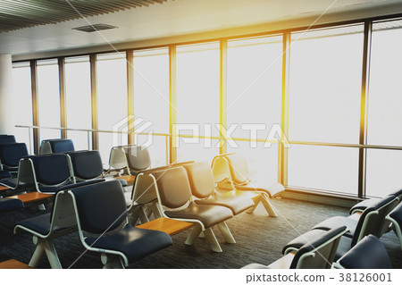 Empty airport terminal waiting area with chairs  38126001