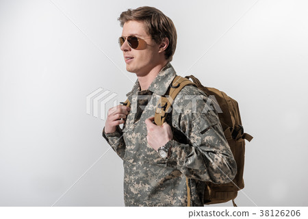 Glad male soldier holding his rucksack 38126206