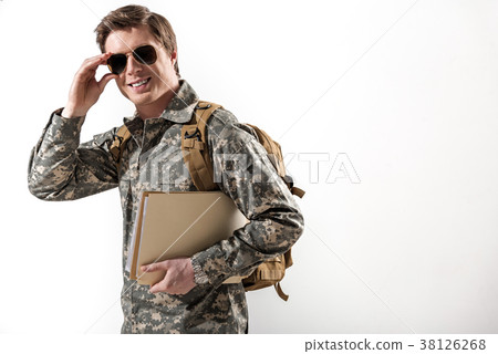 Pleased military guy adjusting his eyeglasses Pleased military guy adjusting his eyeglasses 38126268