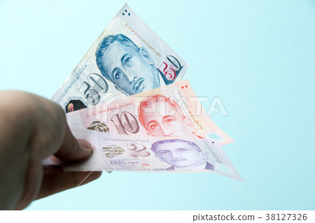 Business man hold 2, 10, 50 Singapore dollar bank Business man hold 2, 10, 50 Singapore dollar bank 38127326