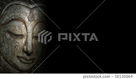 Buddha faces carved out of wood Buddha faces carved out of wood 38130864