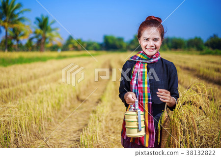 farmer woman with tiffin carrier in rice field farmer woman with tiffin carrier in rice field 38132822