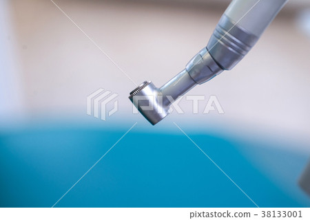 Different dental instruments and tools in a 38133001