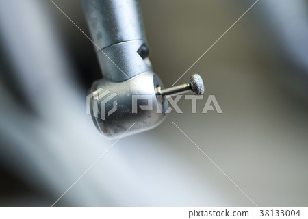 Different dental instruments and tools in a 38133004