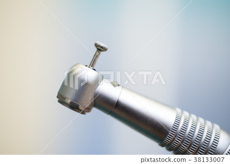 Different dental instruments and tools in a 38133007