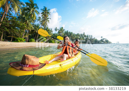 Asian kid to play Kayak on the beach on Koh Kood 38133219