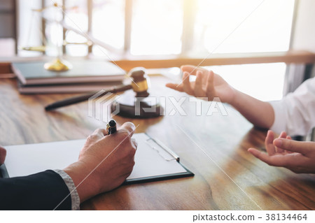 Male lawyer or judge consult having team meeting with client, La 38134464