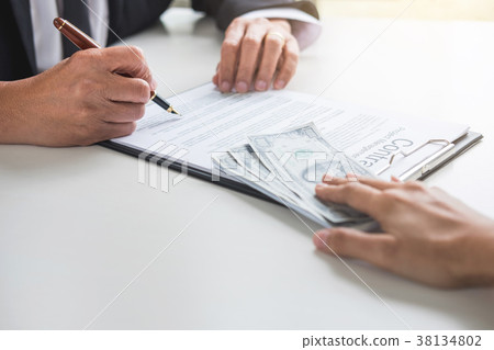 Bribery and corruption concept, bribe in the form of dollar bill 38134802