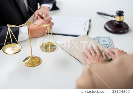 Bribery and corruption concept, bribe in the form of dollar bill 38134803