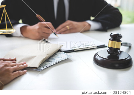 Bribery and corruption concept, bribe in the form of dollar bill 38134804