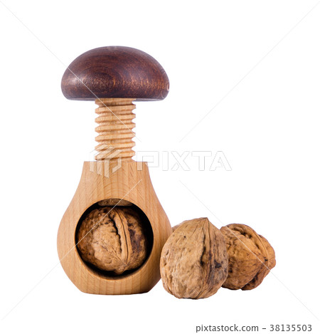 Whole walnuts and wooden screw nutcracker  38135503