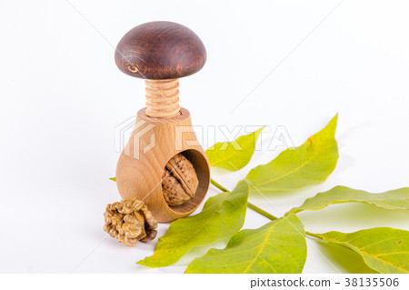Whole walnuts and wooden screw nutcracker 38135506