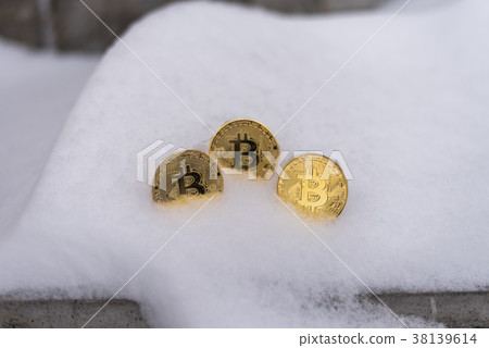 Gold coins bitcoin, crypto-currency in winter Gold coins bitcoin, crypto-currency in winter 38139614