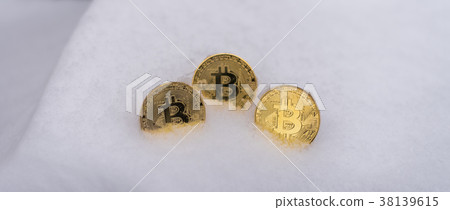 Gold coins bitcoin, crypto-currency in winter Gold coins bitcoin, crypto-currency in winter 38139615