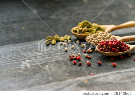 Close up three wooden spoons with colorful spices Close up three wooden spoons with colorful spices 38140663