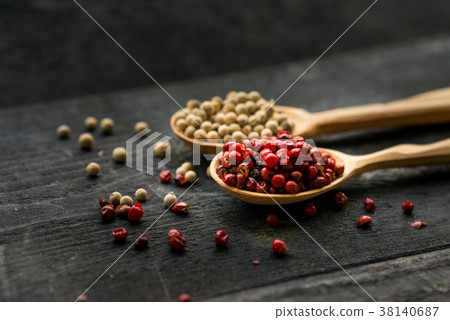 Two wooden spoons with pink and white peppercorn Two wooden spoons with pink and white peppercorn 38140687