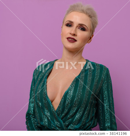 portrait of young woman in a green evening dress 38141196