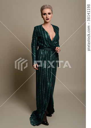 Beautiful young woman in stylish turquoise dress  38141198