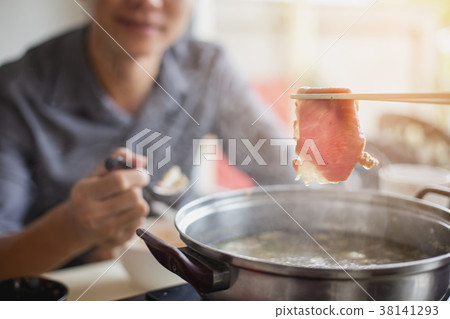 Handsome man taking meat and pork slides Handsome man taking meat and pork slides 38141293