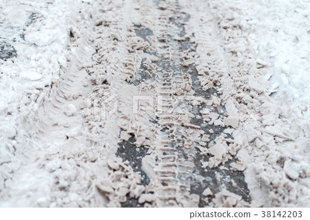 Winter road traces of wheels on snow. Outside the Winter road traces of wheels on snow. Outside the 38142203