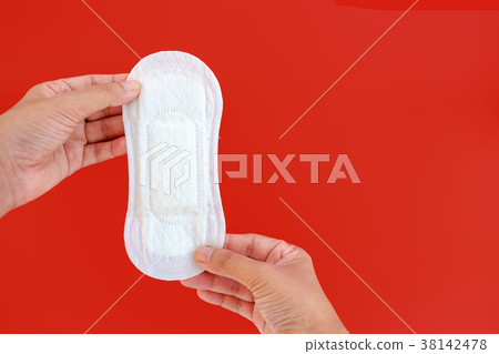 Hand holding feminine sanitary napkin 38142478