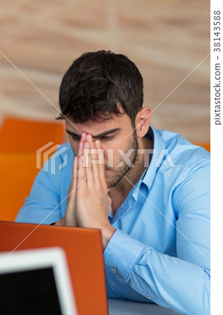 Closeup of Shocked Young Man Working on Laptop 38143588