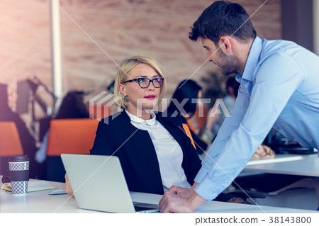 Skilled professional blonde female CEO explaining Skilled professional blonde female CEO explaining 38143800
