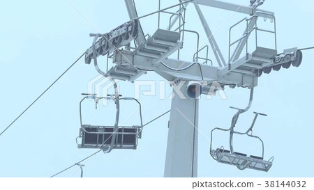 Operating ski chairlift in the fog Operating ski chairlift in the fog 38144032