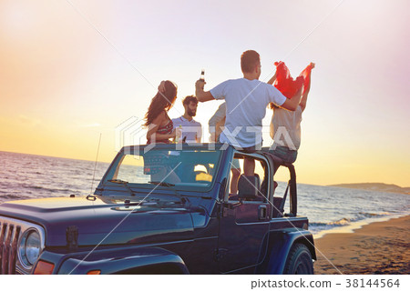 Group of happy friends making party in car - Young Group of happy friends making party in car - Young 38144564