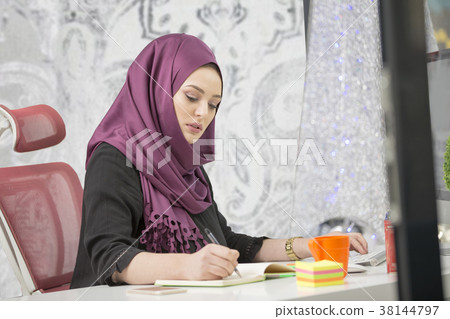 modern female Arabian office worker in office 38144797