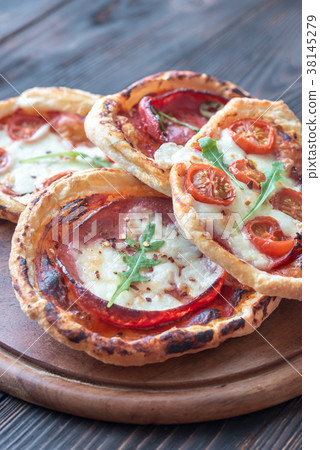 Mini pizzas on the wooden board 38145279