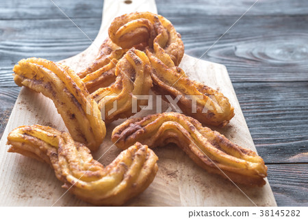 Churros with chocolate sauce 38145282