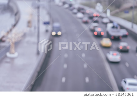 Urban street evening traffic with bokeh lights 38145361