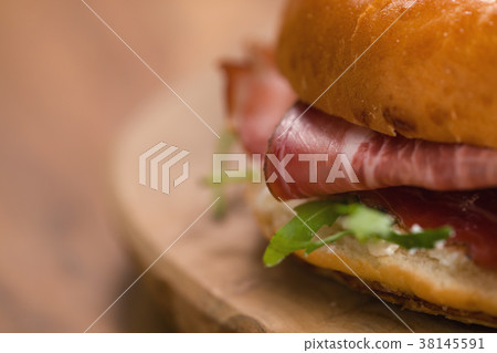 bagel sandwich with prosciutto and cream cheese on 38145591